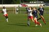 Steffi King, freshman, runs for the ball in an attempt to pass it to her teammate during the game against Lyon College. - Photo by Sarah Palmer