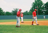 Josh Allen, Union's first baseman from Jackson takes a lead during in the alumni vs. current players game.  Union's head coach Andy Rushing and 2002 alumnas Jeff Wyatt (third base) look on. - Photo by Steven Aldridge