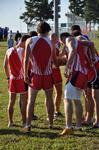 Union men in prayer before the Union Cross Country Invitational. - Photo by Uncredited