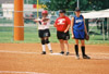 Megan Quarry (20) of Decatur, Ala. and Union graduate assistant coach Jennifer Sabourin communicate at first base during the 2003 NAIA Softball World Series. - Photo by Steven Aldridge