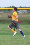 Roger Bolick, senior political science major, runs the ball down the field to score a touchdown for the SAE flag football team. - Photo by Kristi McMurry