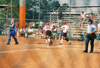 Megan Quarry (20) of Decatur, Ala. and Holly Haycraft (3) of Dyersburg, Tenn. cross the plate for Union at the 2003 NAIA Softball World Series. - Photo by Steven Aldridge