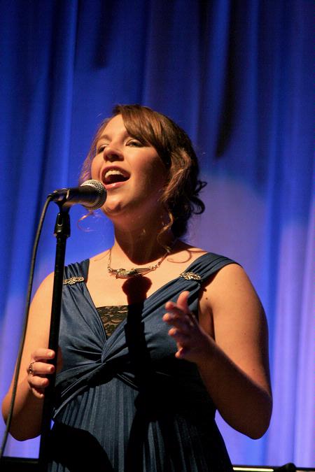 Libby Ford, senior accounting major, sings a filler act during All Sing 2009.