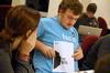 Rob Simpson, sophomore DMS major, shows his fellow AIGA members a design for a t-shirt and it's placement on the shirt. AIGA (American Institute of Graphic Arts) is an organization where students can network with the graphic design community through the Union chapter. - Photo by Kristi McMurry