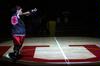 Jessica Graves, senior, runs into the spotlight to greet the crowd at Bulldog Madness. - Photo by Kristi McMurry