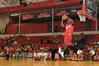 Samuel Danache,  sophomore, does a slam dunk for the judged dunking contest during Bulldog Madness. - Photo by Kristi McMurry