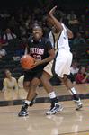 Lady Bulldog Lavanda Ross tries to drive past Vanderbilt's Tiffany Clarke in an exhibition on Friday, Oct. 30. - Photo by Beth Spain