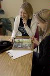 Claire Elmblad, junior engineering major, and Sarah Thompson, junior elementary education major, place phone calls for the Star Center during Campus and Community Day. - Photo by Megan Bailey