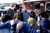 Union art students and faculty break to pray over the worksite and their work at Daddy's Kitchen Table Soup Kitchen on Campus and Community Day. - Photo by Megan Bailey