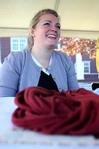Amanda Chambers, sophomore art major, sells her unique t-shirt wraps during Arts in the Park for Homecoming 2009. - Photo by Megan Bailey
