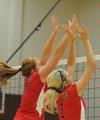 Anna Sims (left) and Katie Adams go up for a block. - Photo by Morris Abernathy