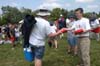 Director of Enrollment Services Robbie Graves hands out frisbees at a Jump 5 concert sponsored by Union in Franklin, Tenn. - Photo by Jim Veneman