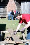 Travis Lutz, junior history major, works on a building project for Green Frog Village on Campus and Community Day. - Photo by Kristi McMurry