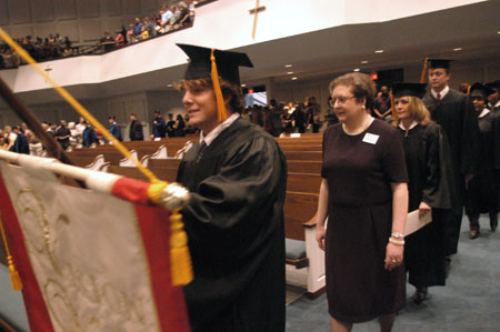 Graduates file in during the processional at the August 2003 commencement exercises held at West Jackson Baptist Church.