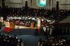 Tim Smith, dean of the school of nursing, announces the names of the fall nursing graduates as they proceed across the stage to receive their diploma from President Dockery. - Photo by Sarah Palmer