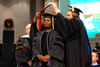 Melinda Harper receives her hood for the doctor of education from Provost Carla Sanderson during fall graduation. - Photo by Kristi McMurry