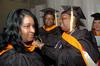 MSN graduates Marisa Taylor assists Shelia Jordan with her gown as Sherri Serca (middle) looks on before Union's fall graduation ceremonies begin. - Photo by Beth Spain