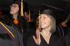 Hannah Brack, social work graduate, waves to family before fall graduation ceremonies begin at West Jackson Baptist Church. - Photo by Beth Spain