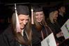 Victoria Green and Kelly Palmer, music education graduates, look over their diplomas during fall graduation. - Photo by Beth Spain