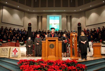 President Dockery welcomes a record 346 students for fall graduation at West Jackson Baptist Church. 
