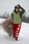 Leslie Ragon, senior social work major, climbs up a hill near pleasant plains after sledding down on a cardboard box, Friday, Jan 29. - Photo by Beth Spain