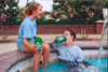 Life Group leaders Rachel Lovelace and Lance Parrott enjoy a refreshing dip in the fountain. - Photo by Uncredited