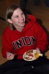 Renee Matz, junior English major, enjoys Valentine's Day themed food at the Mugs 'N Kisses event hosted by Residence Life for women students. - Photo by Kristi McMurry