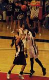 Jessica Graves, senior journalism major, watches as Zeinab (Sarah) Chan, junior history major, battles for the rebound against Freed Hardeman.  - Photo by Abigail Harris
