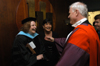Dr. Randall Bush congratulates Dr. Ann Singleton and Juanita Cotner in the receiving line after the announcement of Faculty & Staff of the Year. - Photo by Jim Veneman