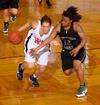 Laura Crittendon, senior athletic training major, dribbles past her Southern Polytechnic State University opponent in the Second Round game of the NAIA National Tournament. The Lady Bulldogs won 70-47. - Photo by Morris Abernathy