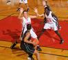 Kaitlin Dudley, senior physical education and health major, and Zeinab Chan, junior history major, defend against Southern Polytechnic State University in the Second Round game of the NAIA National Tournament . The Lady Bulldogs won 70-47. - Photo by Morris Abernathy