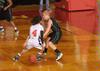 Jessica Graves, senior journalism major, dribbles past her Southern Polytechnic State University opponent in the Second Round game of the NAIA National Tournament. The Lady Bulldogs won 70-47. - Photo by Morris Abernathy