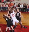 Beatrice Awino Duol, junior learning foundations major, goes up for a rebound in the Quarterfinals game of the NAIA National Tournament against Oklahoma Christian University. The Lady Bulldogs won 83-55. - Photo by Morris Abernathy
