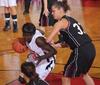 Zeinab Chan, junior history major, dribbles around her Oklahoma Christian University opponent in the Quarterfinals game of the NAIA National Tournament. The Lady Bulldogs won 83-55. - Photo by Morris Abernathy