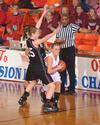 Kayla Hudson, junior political science major, dribbles through her Oklahoma Christian University opponents in the Quarterfinals game of the NAIA National Tournament. The Lady Bulldogs won 83-55. - Photo by Morris Abernathy