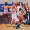 Kaitlin Dudley, senior physical education and health major, runs down the court with her Oklahoma City University opponent in the Semifinals of the NAIA National Tournament. The Lady Bulldogs advanced to the finals with a win of 63-61. - Photo by Morris Abernathy