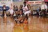Zeinab Chan, junior history major, breezes past her Oklahoma City University opponent to get the ball in the Semifinals of the NAIA National Tournament. The Lady Bulldogs advanced to the finals with a win of 63-61.  - Photo by Morris Abernathy