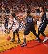 Zeinab Chan, junior history major, dribbles around her Oklahoma City University opponent in the Semifinals of the NAIA National Tournament. The Lady Bulldogs advanced to the finals with a win of 63-61.  - Photo by Morris Abernathy