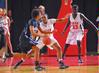 Lavanda Ross, sophomore accounting major, and Zeinab Chan, junior history major, play defense in the Semifinals of the NAIA National Tournament against Oklahoma City University. The Lady Bulldogs advanced to the championship game with a win of 63-61. - Photo by Morris Abernathy