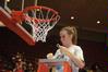 Kayla Hudson, junior, cuts a piece of the net after the Lady Bulldogs defeated Azusa Pacific University to become NAIA Division I National Champions.  - Photo by Morris Abernathy