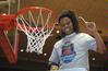 Jessica Graves, senior, cuts a piece of the net after the Lady Bulldogs defeated Azusa Pacific University to win the NAIA National Tournament.  - Photo by Morris Abernathy