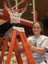 Kayla Bryant, junior, cuts a piece of the net after the Lady Bulldogs defeated Azusa Pacific University to become NAIA Division I National Champions. - Photo by Morris Abernathy