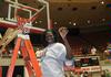 Beatrice Awino Duol, junior, cuts a piece of the net after the Lady Bulldogs defeated Azusa Pacific University to win the NAIA National Tournament. - Photo by Morris Abernathy