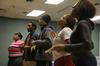 Members of MOSAIC choir rehearse for an upcoming performance. The group has performed at events such as chapel and the Black History Month program.
 - Photo by Angela Abbamonte