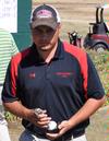 Ryan Chandler receives his trophy for a third place finish in the Union University Spring Invitational. - Photo by Steven Aldridge