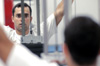 Fabio Buarque of Belo Horizontg, Brazil concentrates as he works out in the Wellness Center. - Photo by Lindsay Stavish