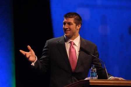 Tim Tebow speaks at the Roy L. White Legacy Golf and Gala event. Tebow encouraged guests with his story and urged everyone to "finish strong."