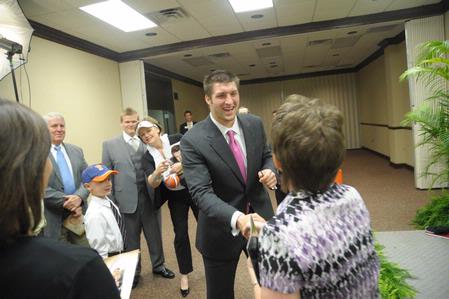 Tim Tebow, keynote speaker at the Roy L. White Legacy Golf and Gala, greets guests after the event.