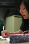 Shinae Giffin, sophomore art major, works on a drawing for a student-curated art show in Barefoots Joe.  - Photo by Kristi McMurry