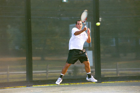 Christiano Castro returns a shot during practice.
